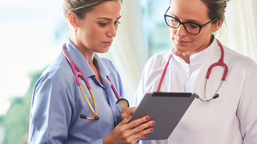 Clinicians reviewing a patient order together
